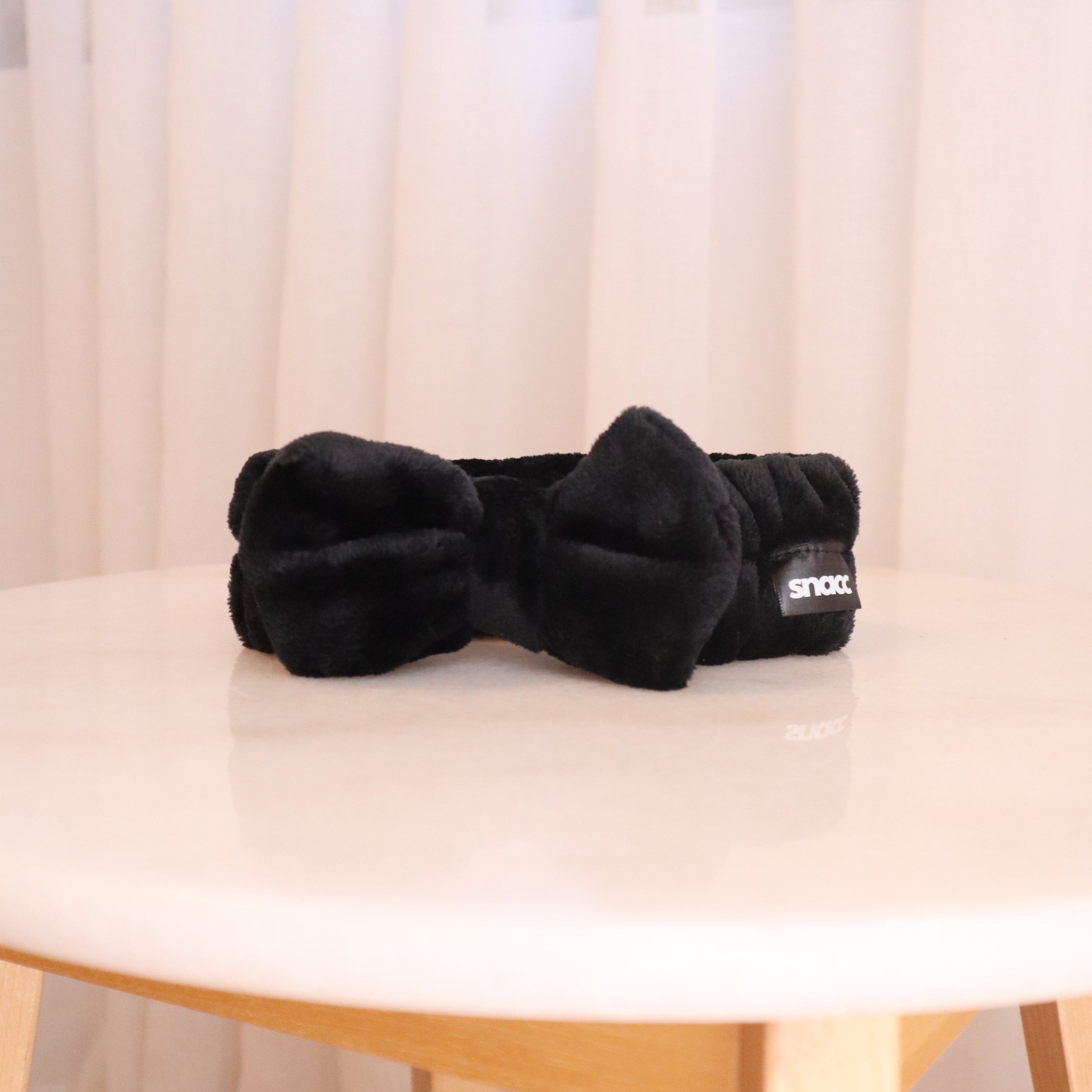 Tied & Tucked – Black Bow Skincare Headband