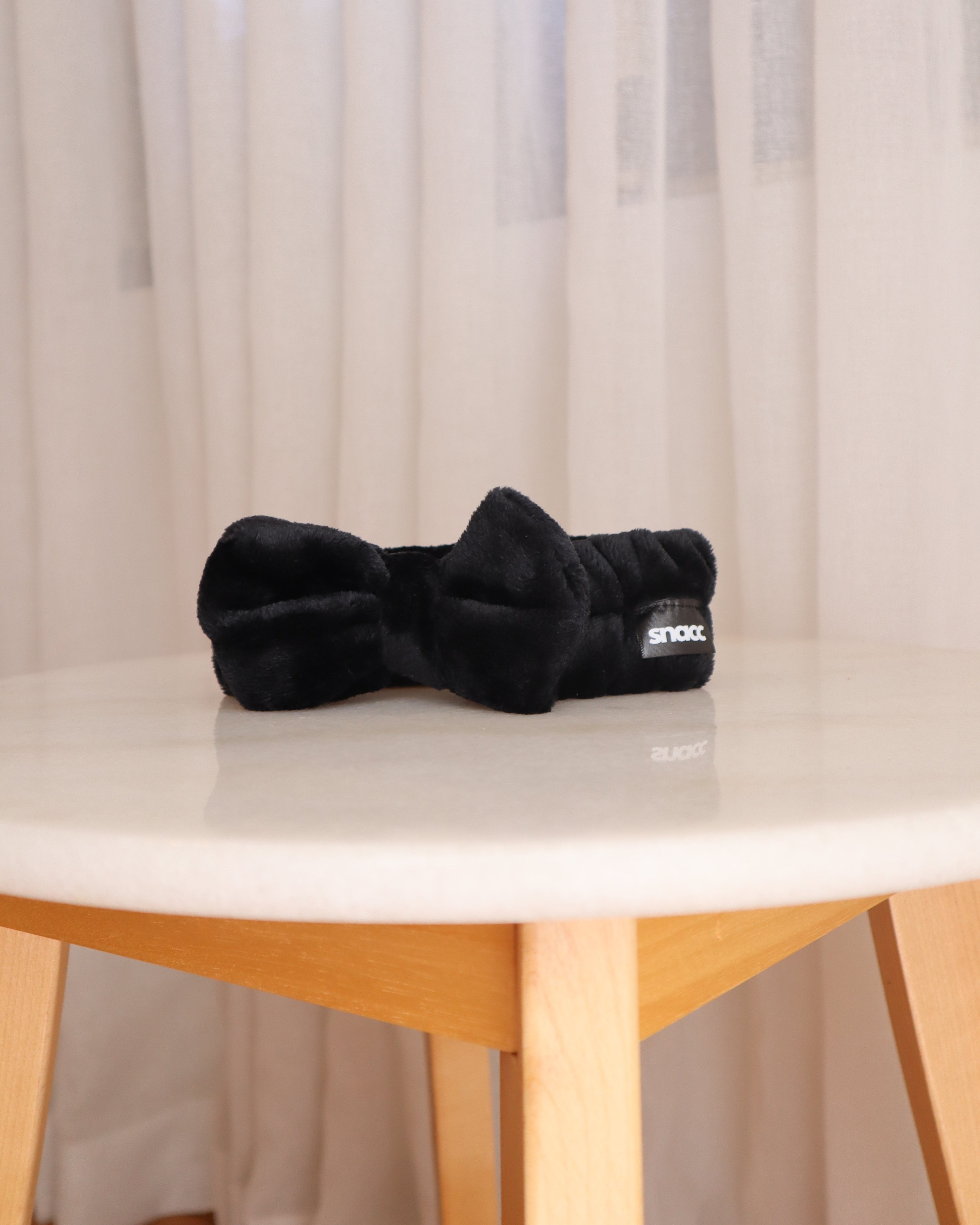 Tied & Tucked – Black Bow Skincare Headband